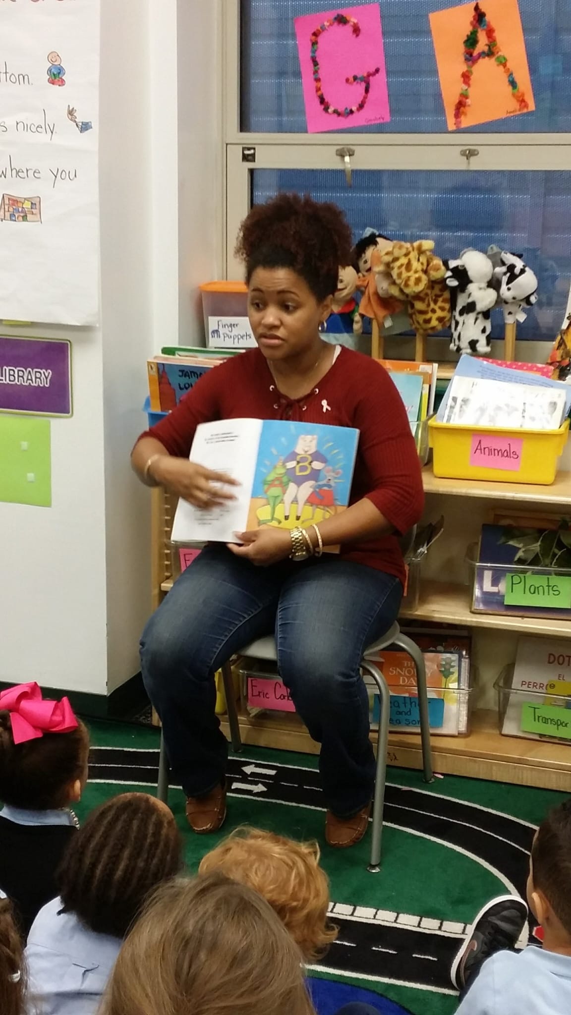 Teacher reading to children in a Teaneck school classroom